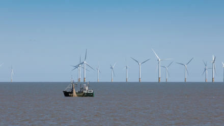 wind farm and fishing boat featured image 575x300px.png